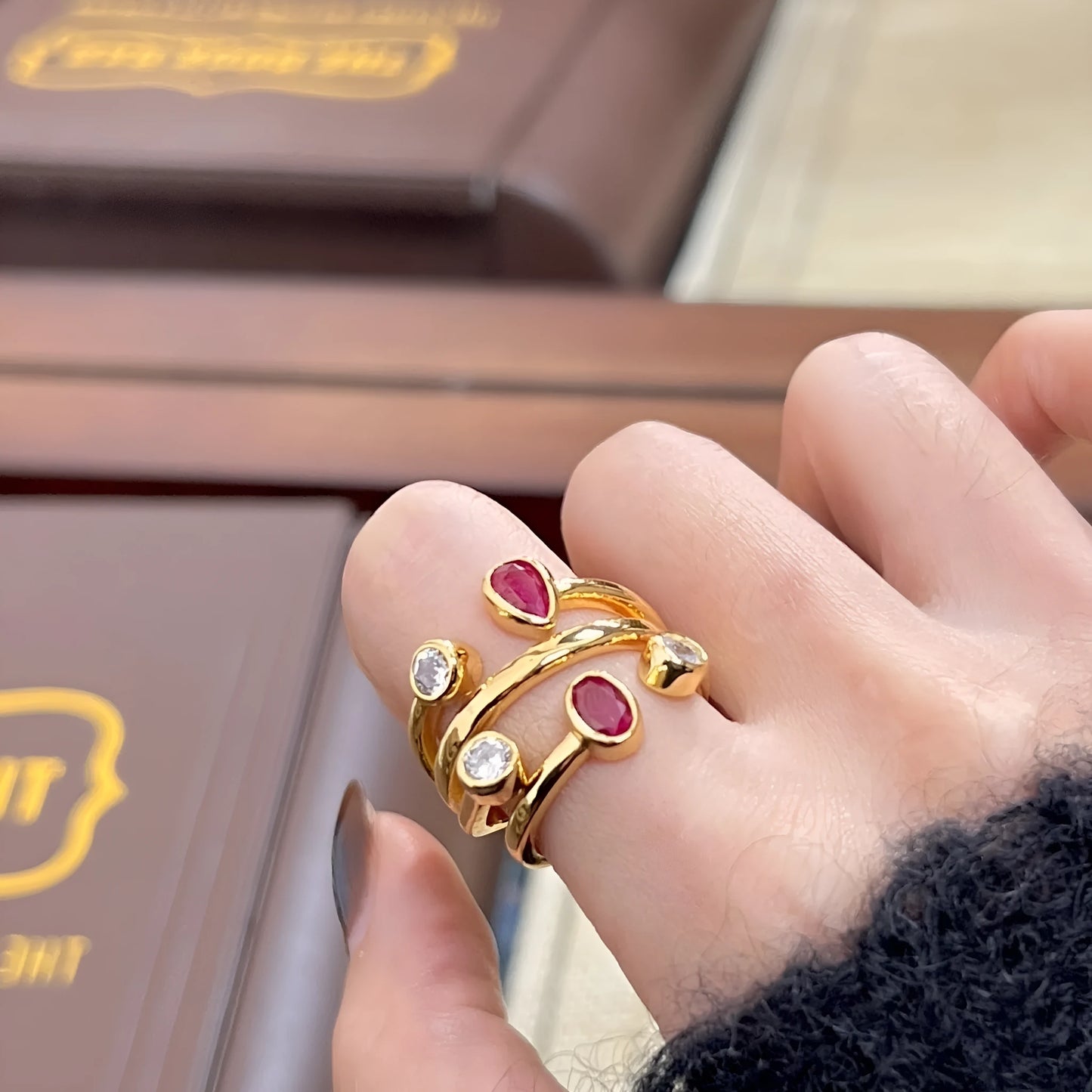 Double-headed diamond ring with irregular geometric design in red and white electroplated finish
