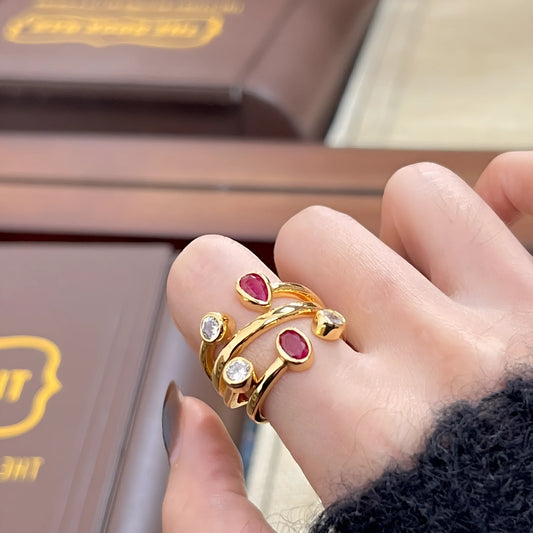 Double-headed diamond ring with irregular geometric design in red and white electroplated finish