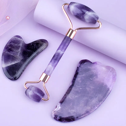 Amethyst facial roller set with heart-shaped gua sha and claw massage tools on white background