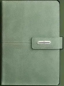 A5 notebook with imitation leather cover in a choice of colours including black, red, green, blue, and orange.