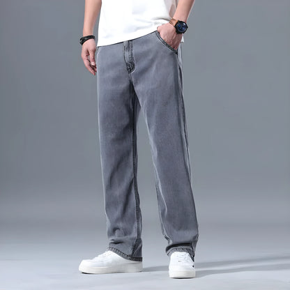 Man wearing light blue loose-fit straight-leg lyocell blend casual jeans.