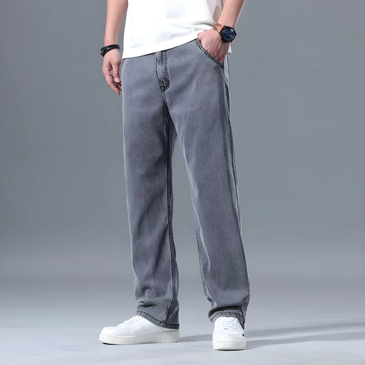 Man wearing light blue loose-fit straight-leg lyocell blend casual jeans.