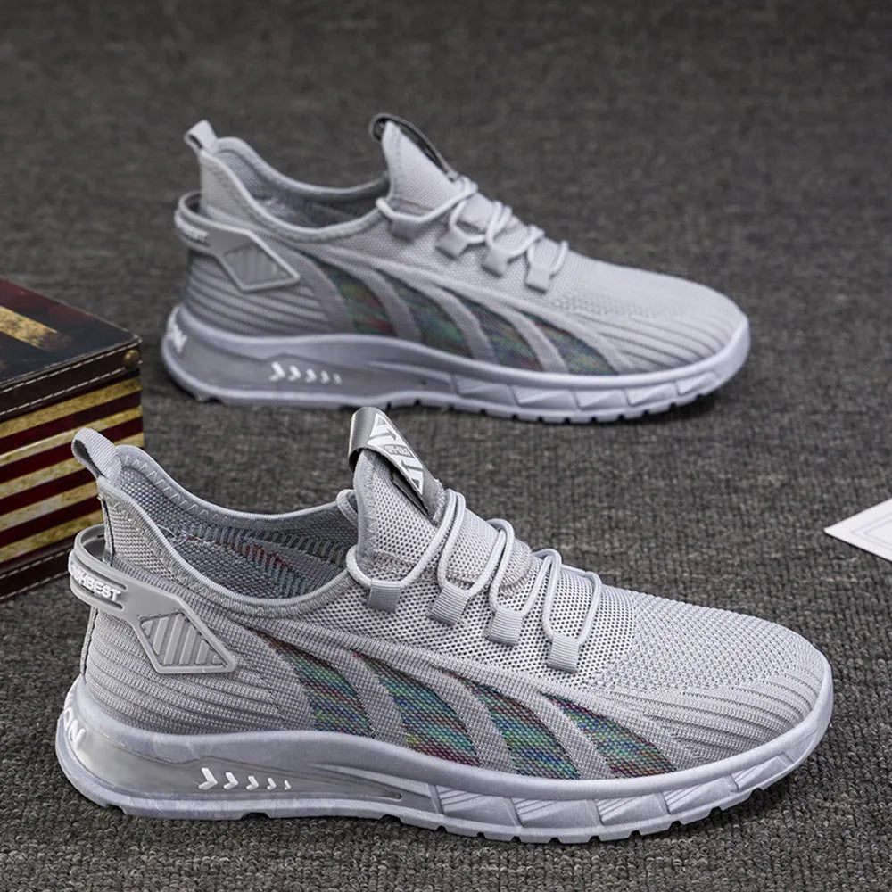 Low-top black mesh sneakers with a flat plastic sole and shallow cut design on a white background.