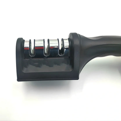 White plastic kitchen knife sharpener measuring 15cm long with special stone sharpening element