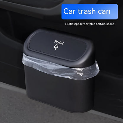 Black plastic folding car trash can mounted on vehicle seat back