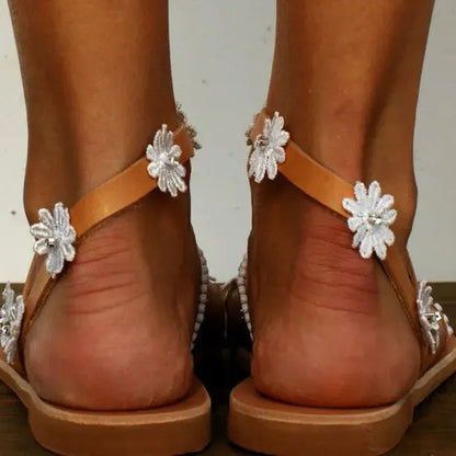 Brown women's Roman sandals with floral pattern, herringbone toe design, artificial PU upper and rubber sole