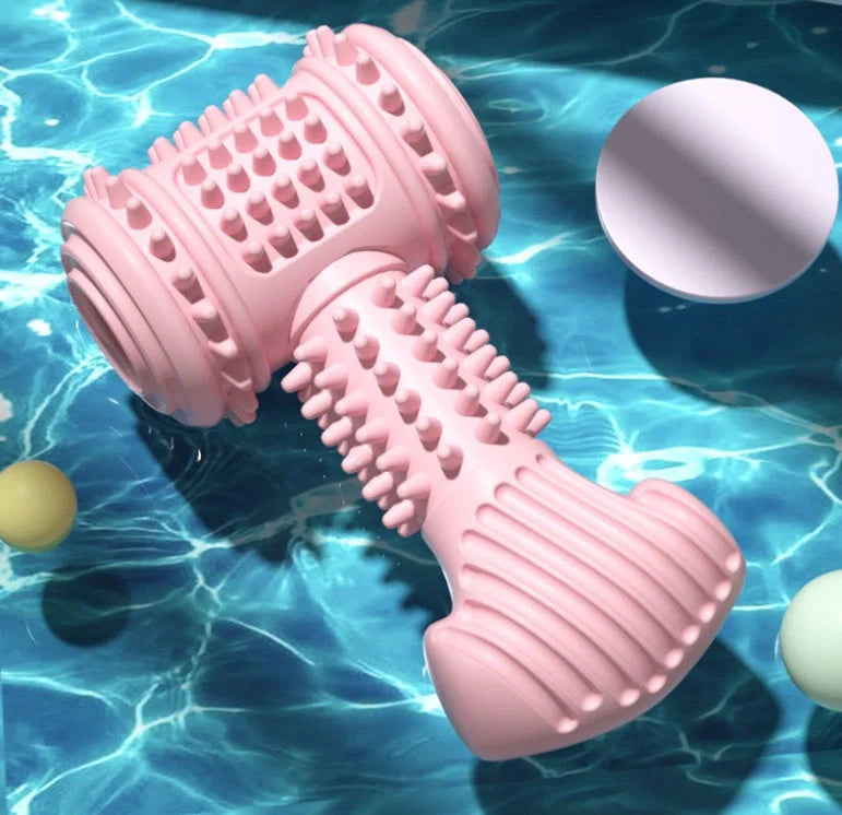 Indestructible TPR dog chew toy in blue, pink, and green for teeth cleaning and anxiety relief