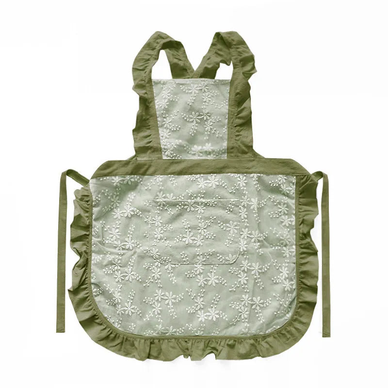 Minimalist kitchen apron with X-strap design in cotton linen fabric showing lace trim detail