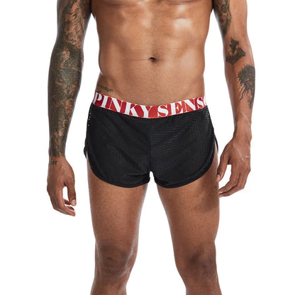 Breathable mesh men's boxer briefs in black, shown laid flat