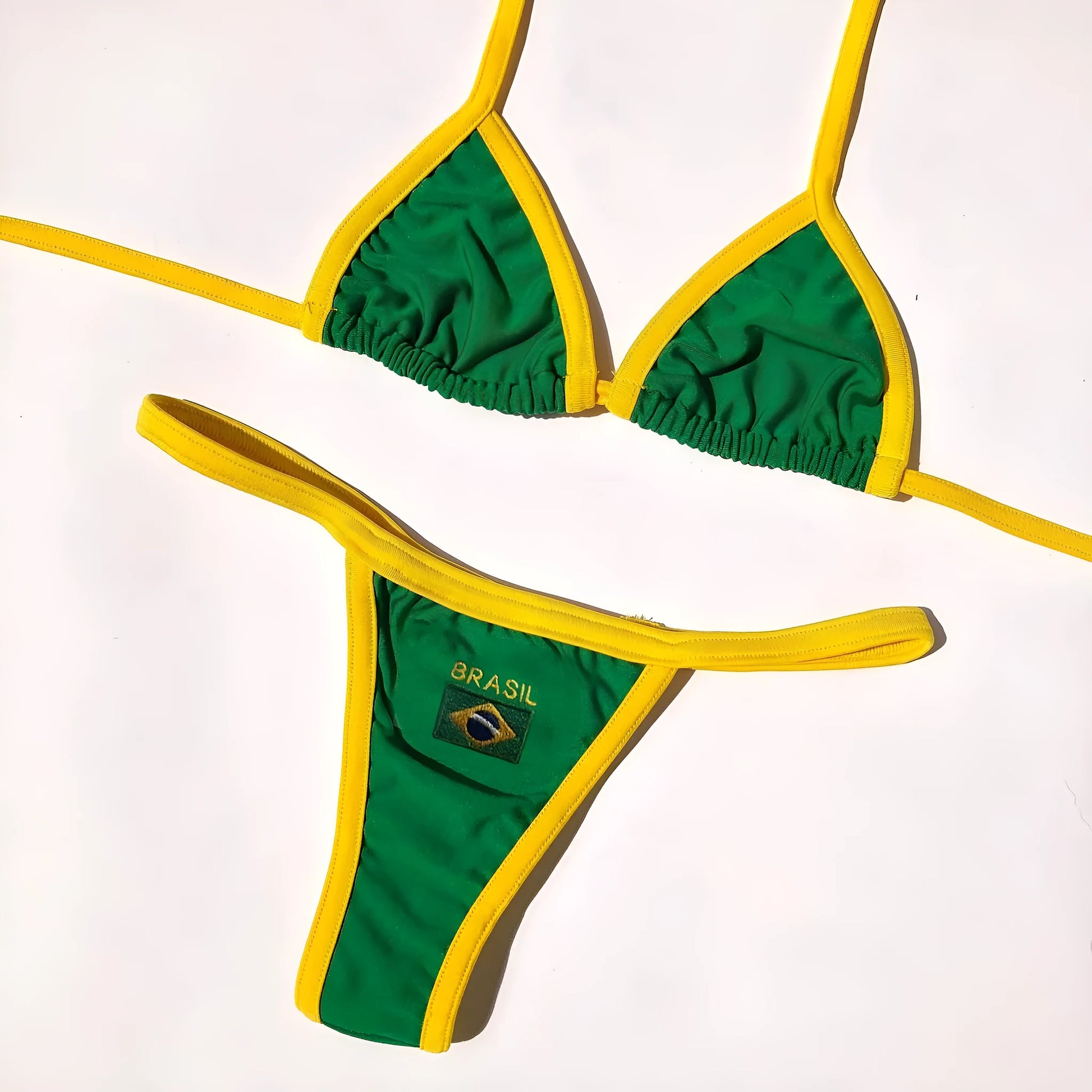 Women's slim fit T-back bikini set in blue, green, or yellow with shorts-length pants.