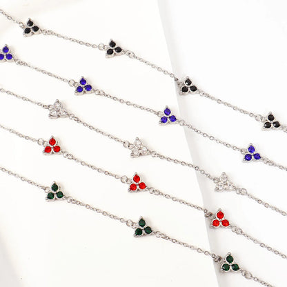 Women's stainless steel bracelet with three triangle-shaped charms in different coloured stone settings
