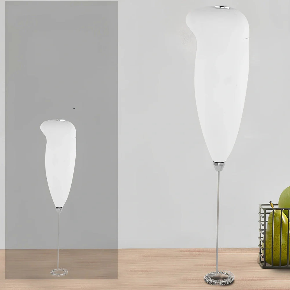Green electric milk frother measuring 21cm tall with 5cm base creating milk foam