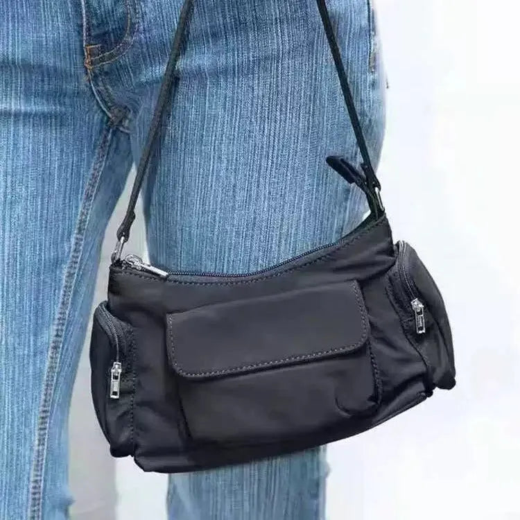 Black PU women's shoulder bag with two pockets and side line detailing, showing dimensions of 24cm length