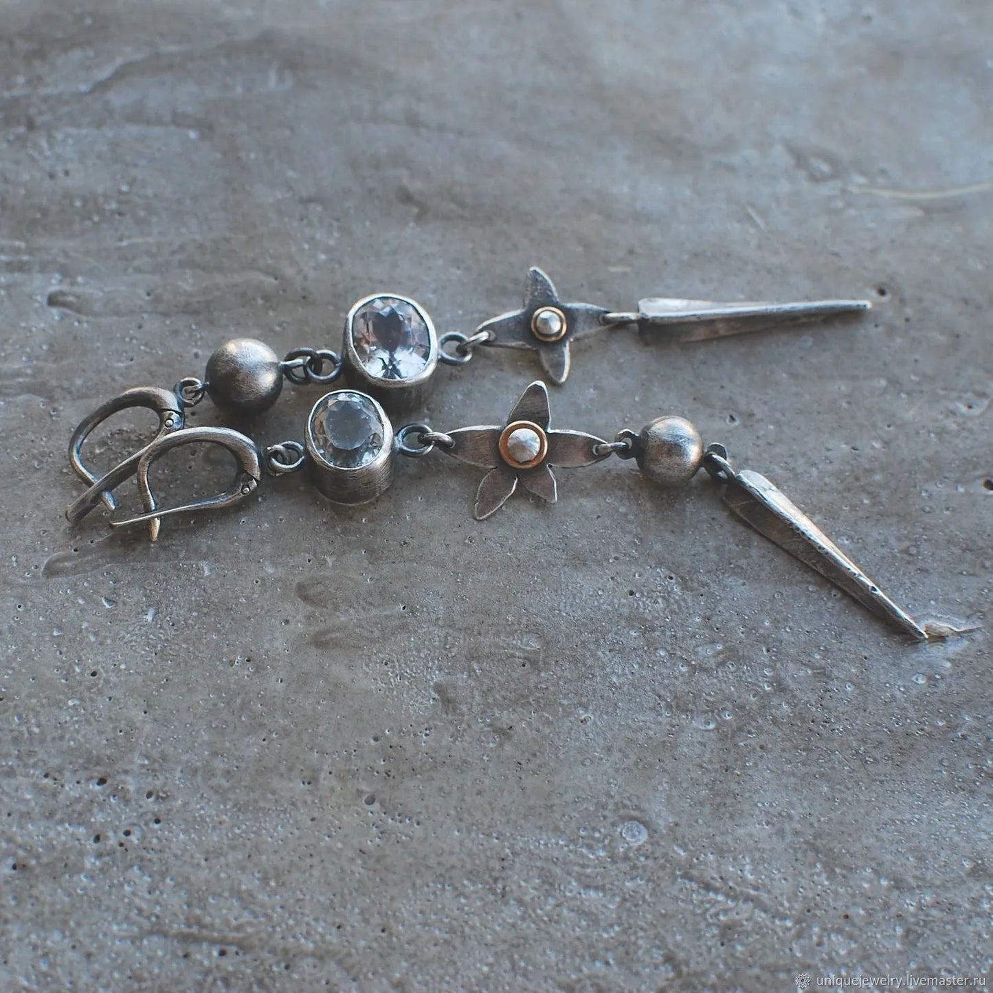 Pair of long antique silver geometric XINGX pendant earrings with rhinestone details on alloy posts.