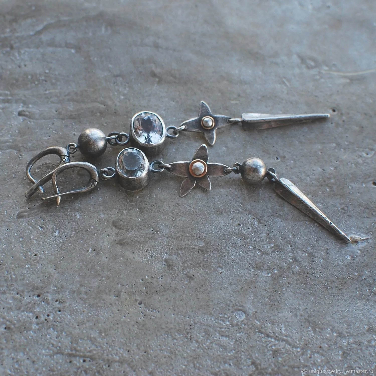 Pair of long antique silver geometric XINGX pendant earrings with rhinestone details on alloy posts.