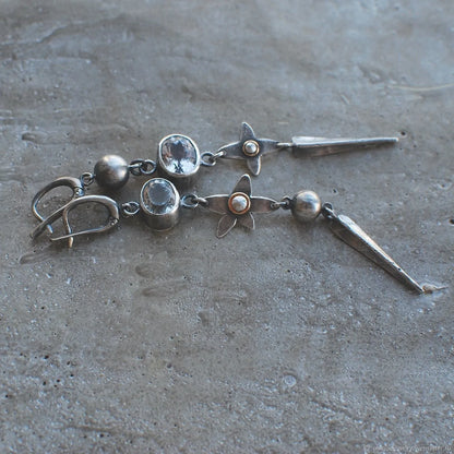 Pair of long antique silver geometric XINGX pendant earrings with rhinestone details on alloy posts.
