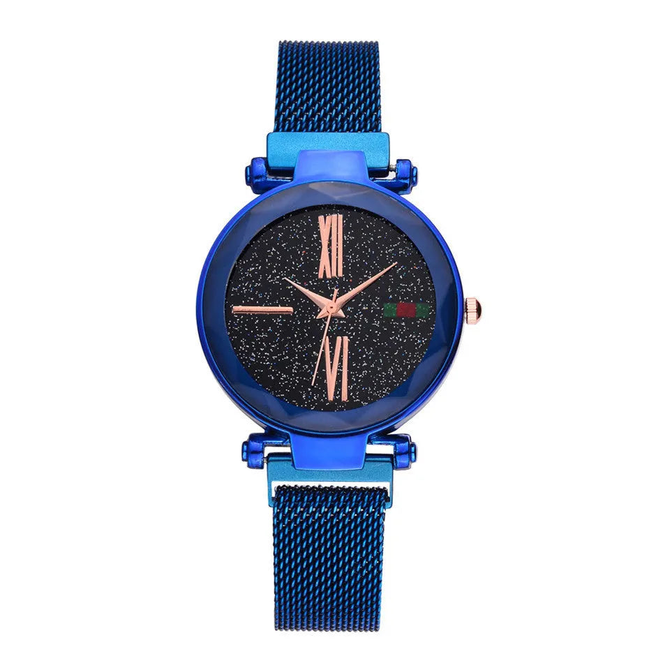 Rose gold ladies watch with round 32mm dial and magnetic stainless steel jewellery clasp on wrist.