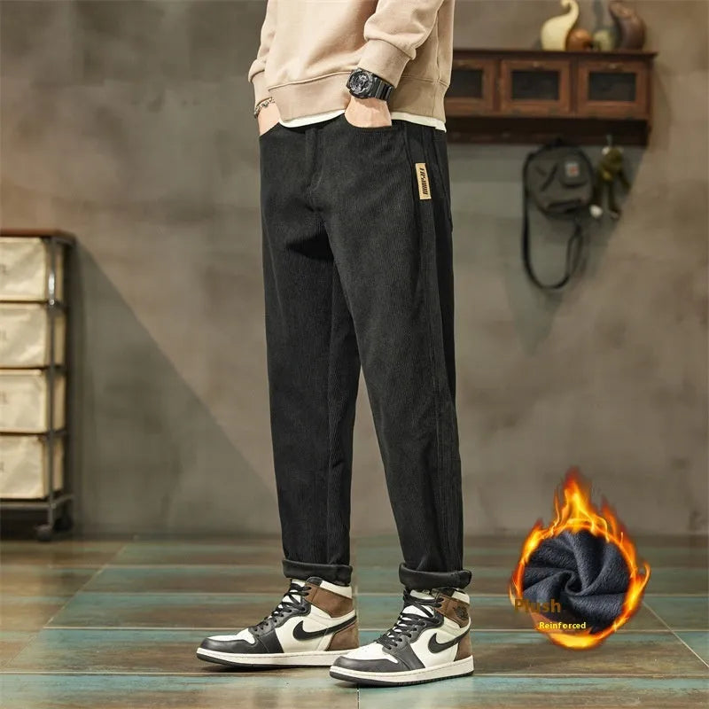 Men's straight-leg corduroy pants in army green colour with tapered fit and mid waist design