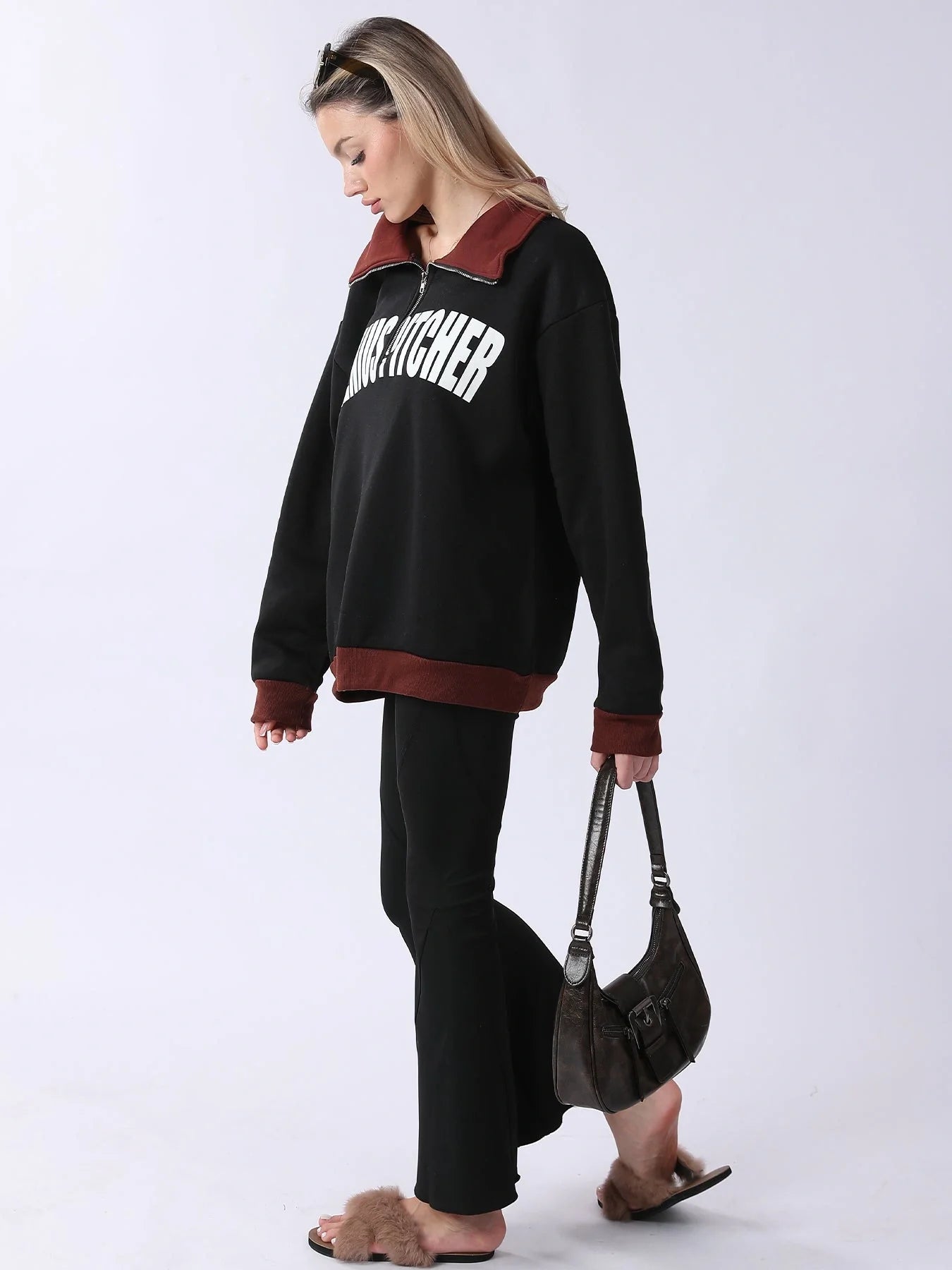 A cozy and comfortable women's long sleeve sweatshirt in black, featuring a relaxed and flattering fit for everyday wear.