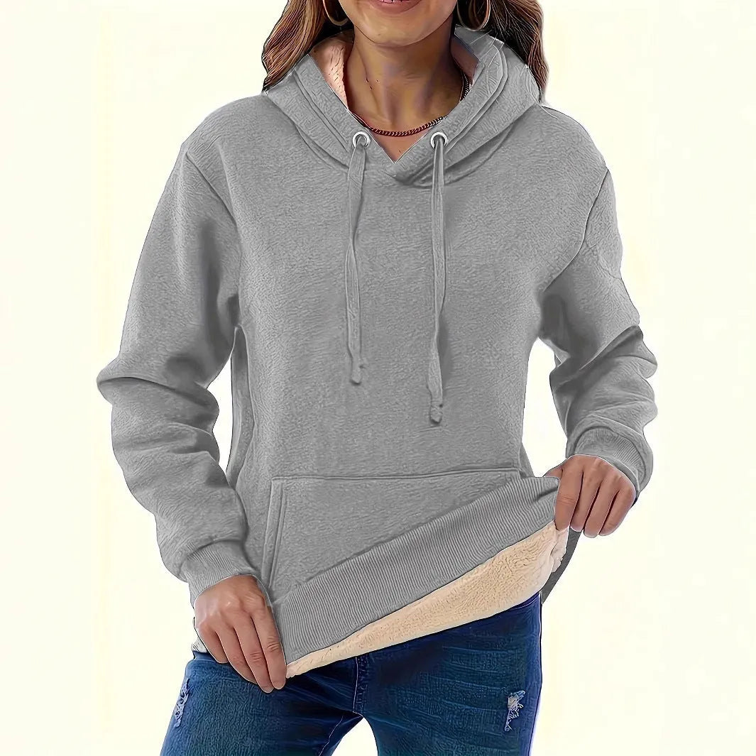 Women's loose fit hooded sweater in thick grey polyester fleece with 3D pattern and front pockets.