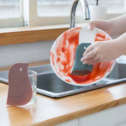Penguin-shaped silicone kitchen scraper with soft blade for cleaning plates and pots