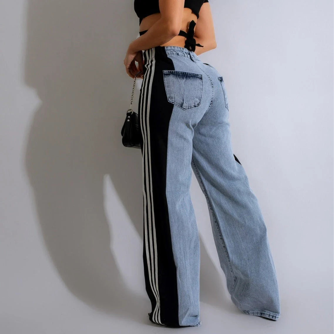 Stylish high-waist denim trousers with patchwork design, available in various color options