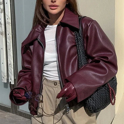 Stylish faux leather jacket with zip-up closure and lapel collar, available in burgundy and black colors