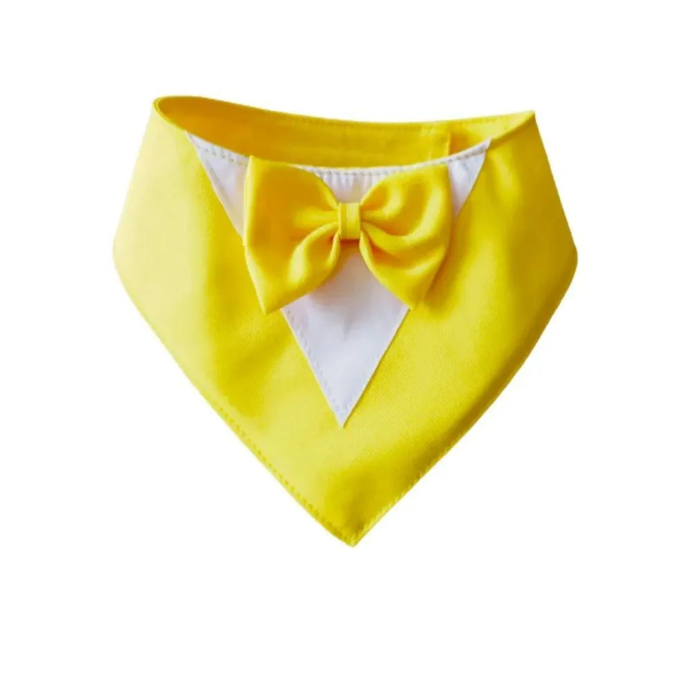 Triangle-shaped pet bib scarf with a bow, shown in a bright colour, displaying the soft fabric and absorbent towelling lining.