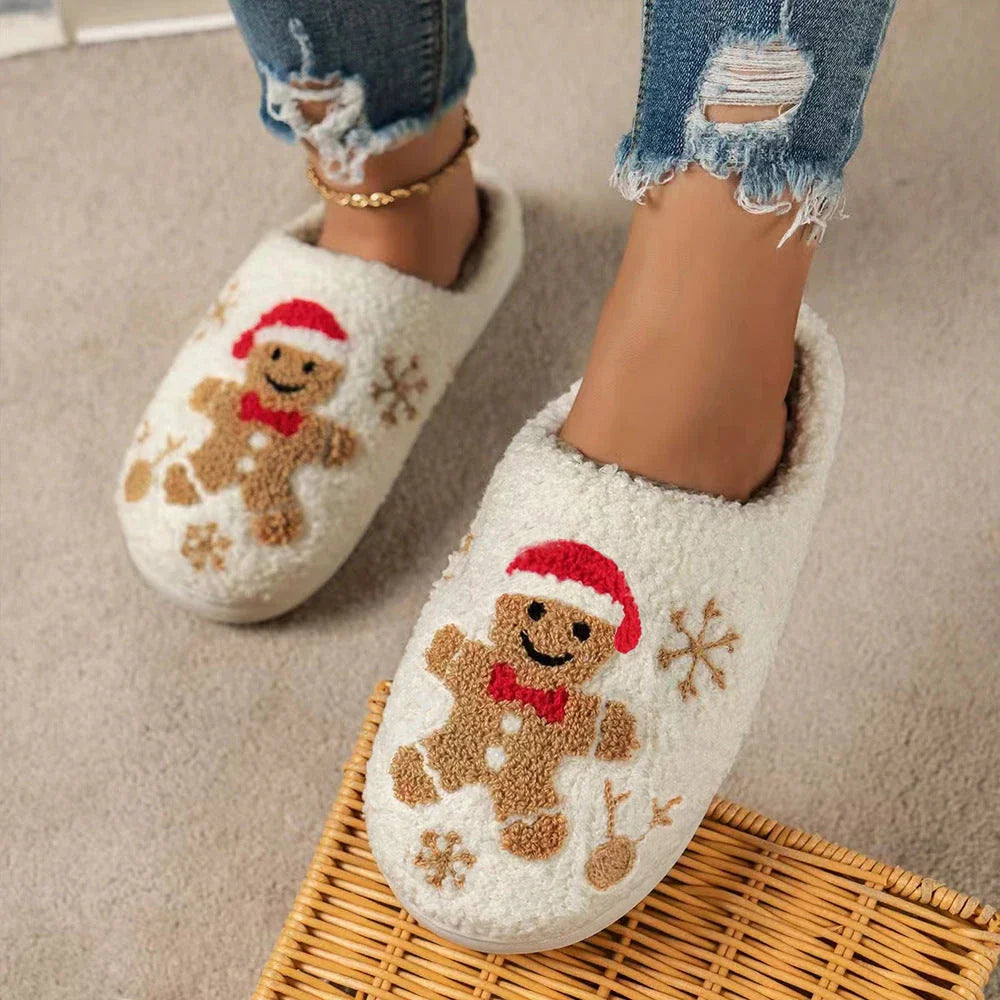 Cozy plush gingerbread slippers with festive snowflake patterns, designed for comfortable indoor wear during the winter season.