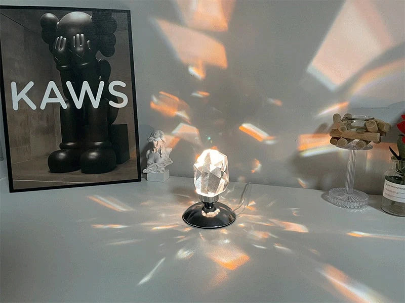 LED Crystal Night Light with remote control and 16 color options on a bedside table