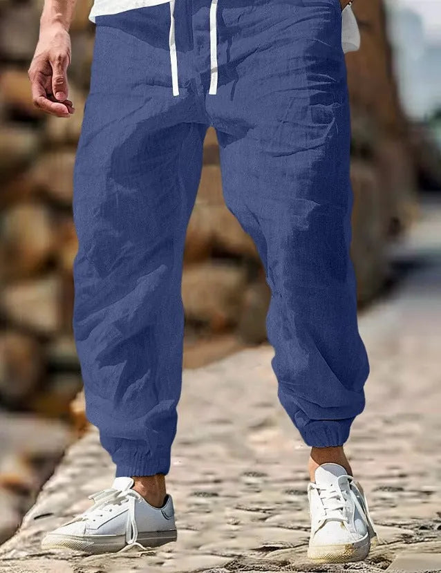 Men's straight-leg cotton trousers with elastic waist in Army Green colour, showing classic fit and summer-appropriate fabric.