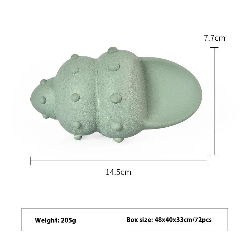 Blue rubber shark-shaped dog toy with food dispensing openings on a white background.