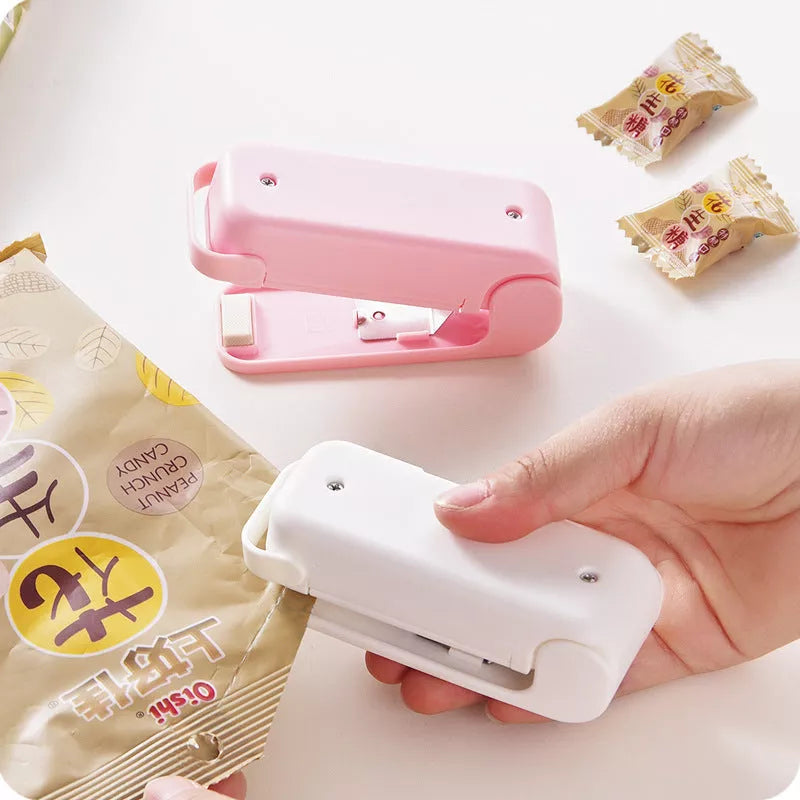 Home Portable Mini Sealing Machine in white and pink with optional magnetic closure