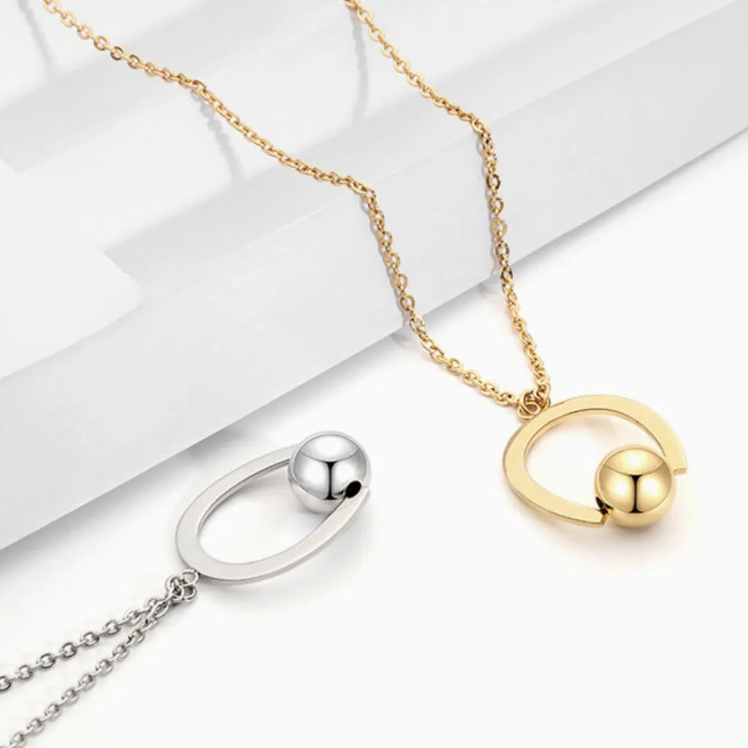 Adjustable stainless steel necklace with geometric pendant and cross chain design in gold or silver finish