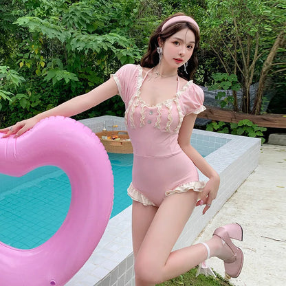 Pink women's conservative one-piece swimsuit with Siamese cut design