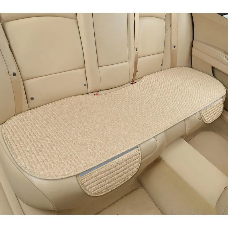 Linen car cushion with plaid pattern in cream colour on automotive seat