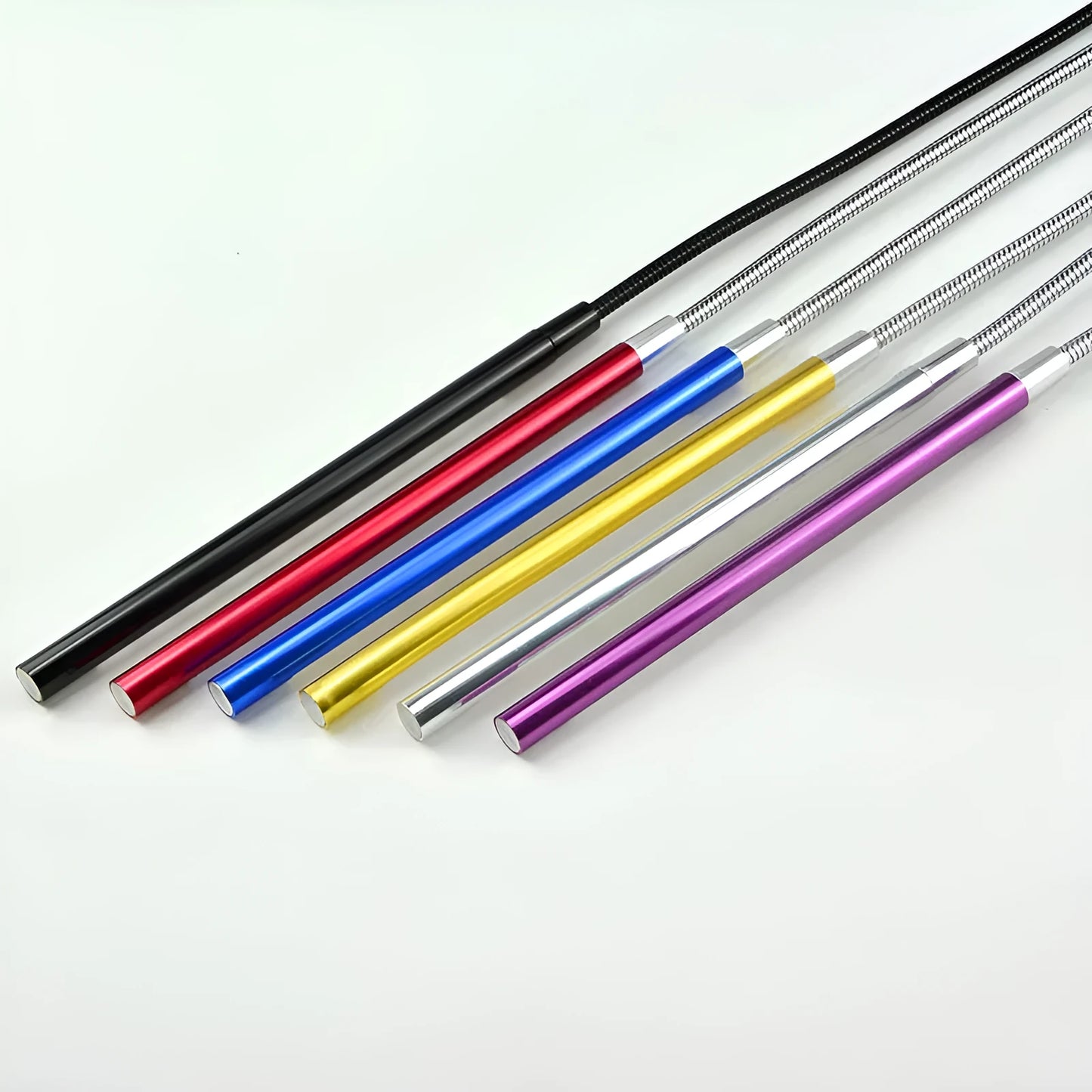 Spiral-shaped silver aluminium alloy USB LED desk lamp on a wooden table.