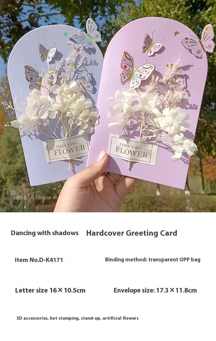 Handmade 3D pop-up greeting card with butterfly shape showing artificial flowers and hot stamping details