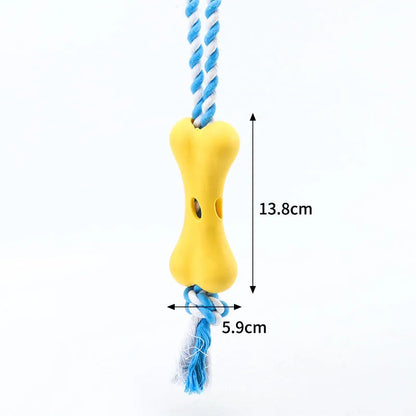 Green porous bone dog chew toy with rope knot texture for treat insertion and dental stimulation