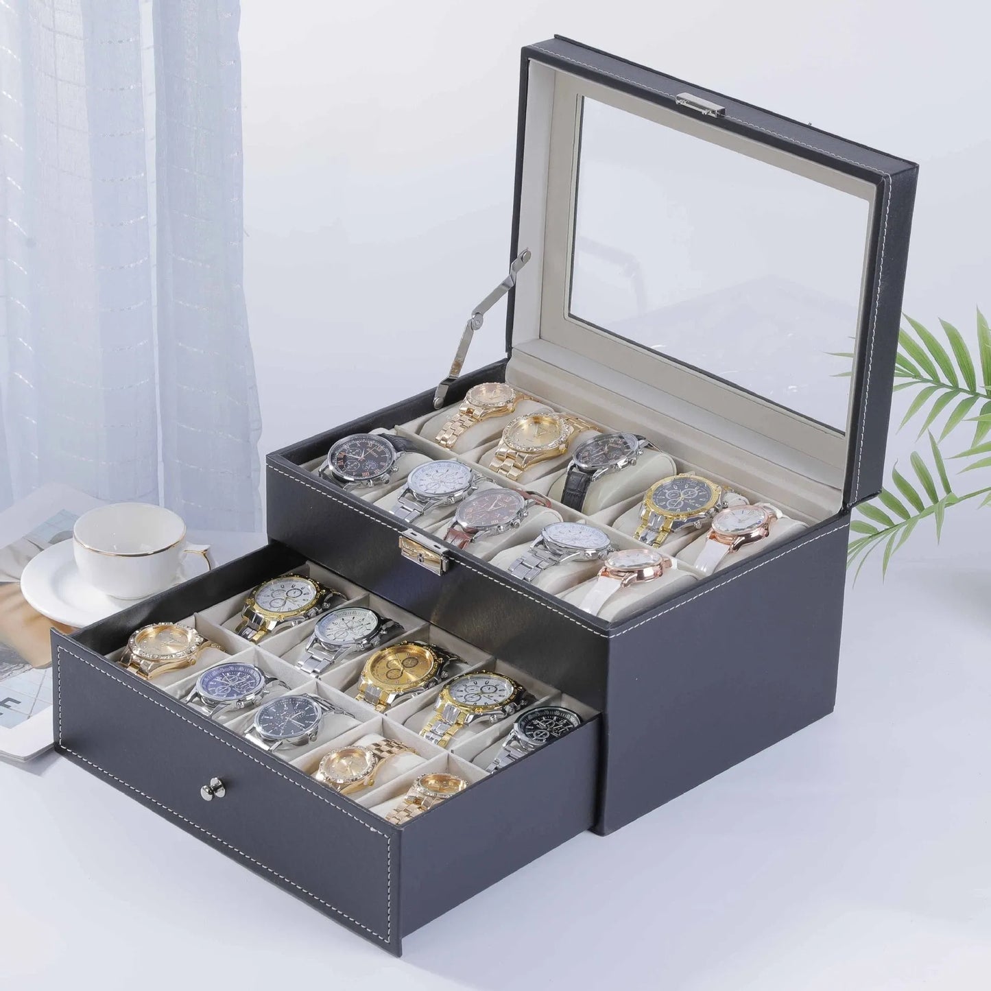 Grey high-grade leather watch storage box with transparent lid showing multiple watch compartments.