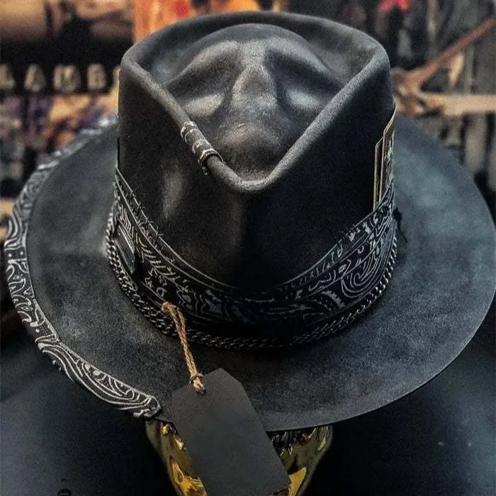 Handmade wool felt skull hat with conical crown design, showing textured surface and distinctive silhouette