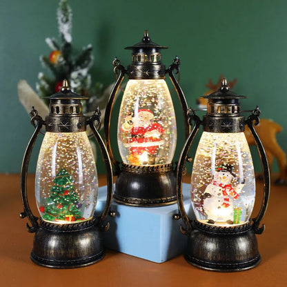 Crystal ball Christmas decoration with LED-lit paper snowman and elderly figures on desktop