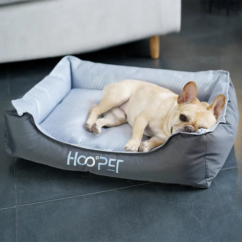 Soft grey dog bed with removable cover showing sizes for small, medium, and large pets