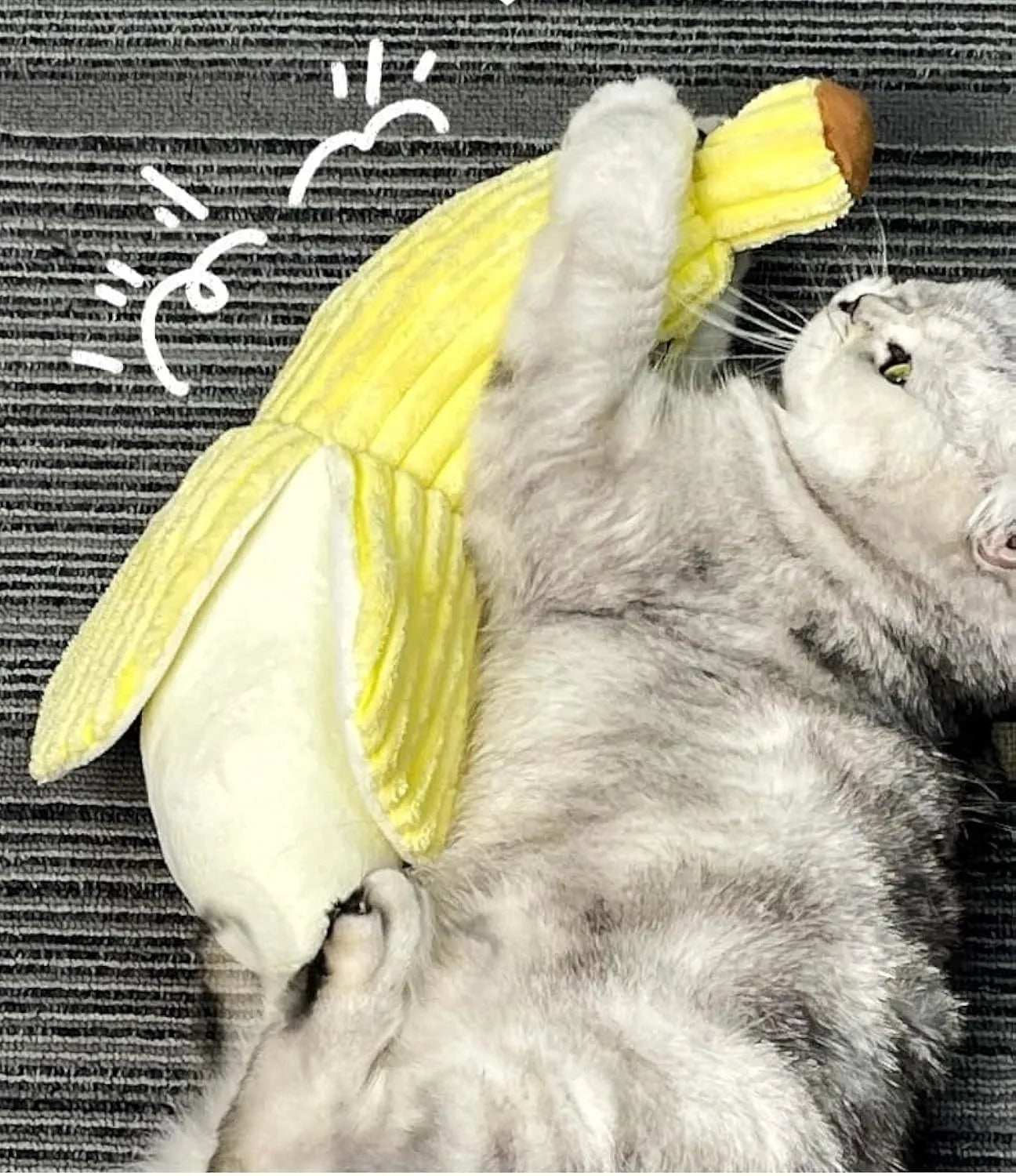 Yellow banana-shaped plush cat toy with a green leaf and crinkle paper inside for sound.