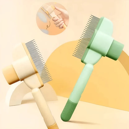 Green pet grooming brush with detachable hair collection tray and soft silicone handle