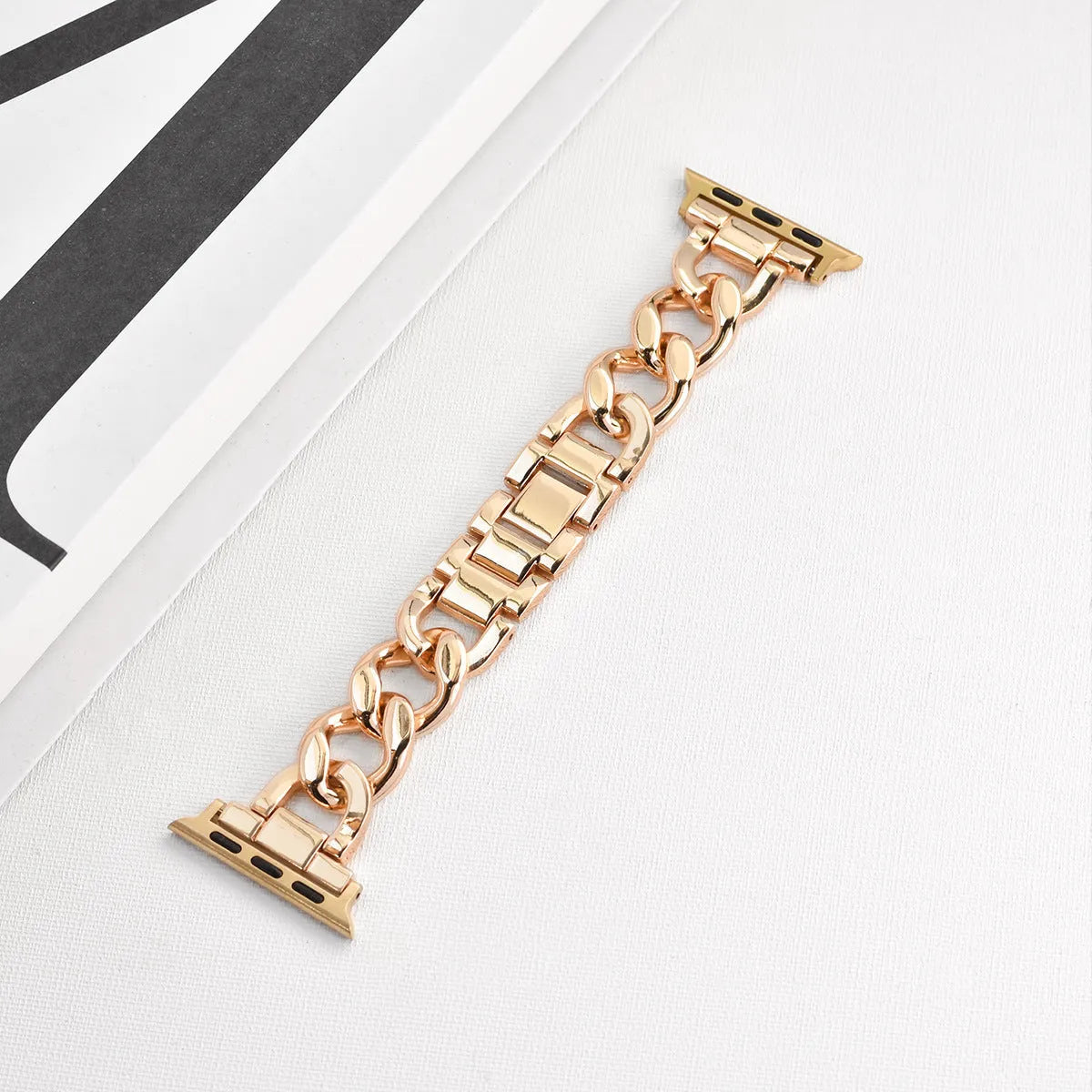 Silver metal link watch strap for Apple Watch with 22mm connectors on a grey background