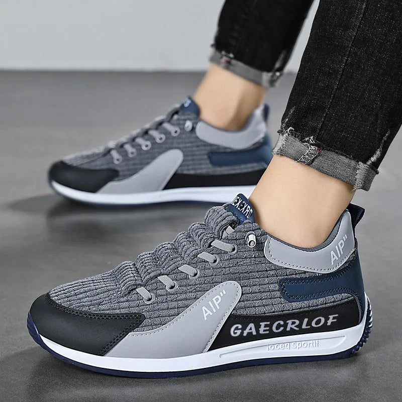 Men's grey and green mesh running shoes with lace-up front and low-top ankle design
