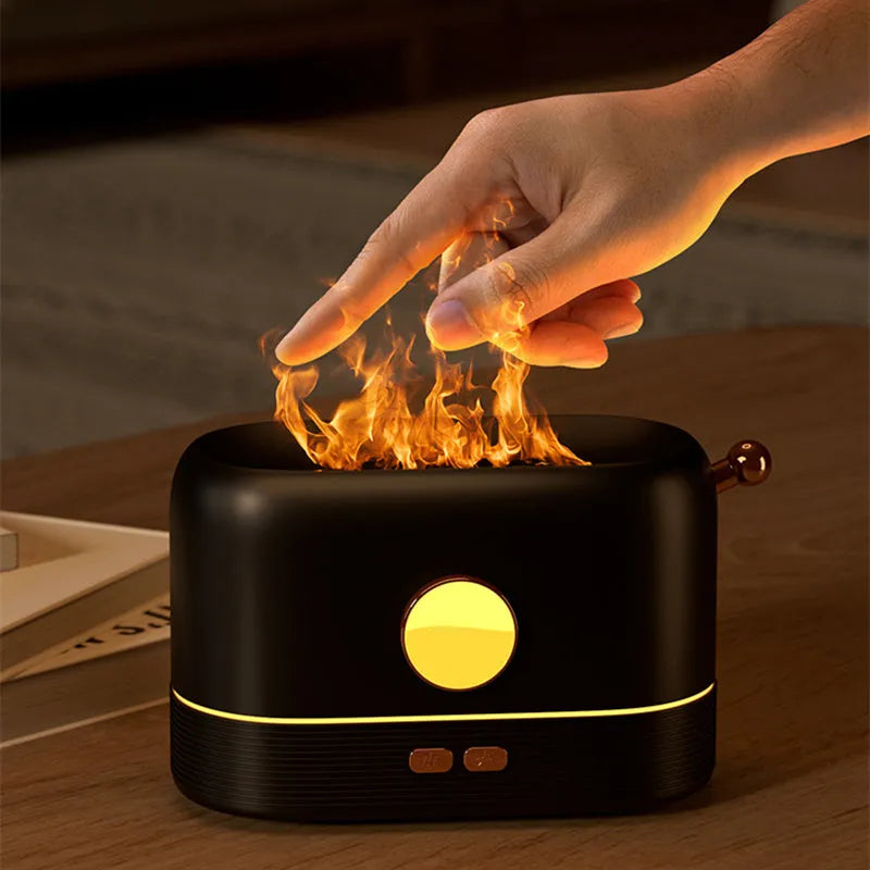 Black USB flame humidifier diffuser with 200ml tank on desktop showing simulation flame effect