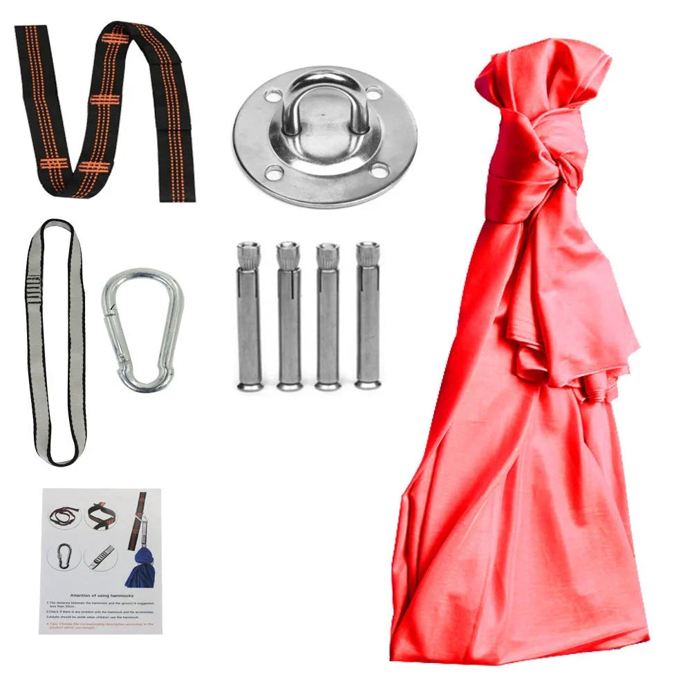 Child in black therapy swing cocoon with multi-loop daisy chain height adjustment system