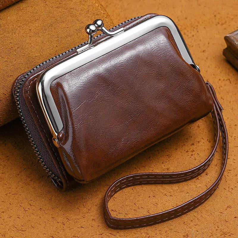 Ladies buckle-fastening coin purse with a 4-inch metal clip and zip, shown in multiple colour options.